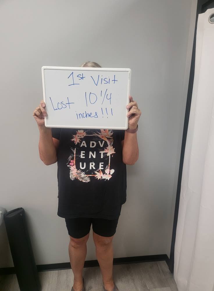 Contour Light client holding a whiteboard: 10¼ inches — Lost on her first visit