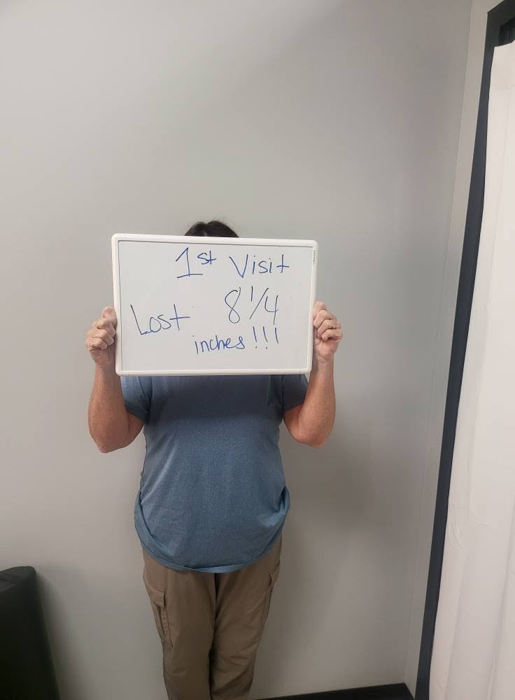Contour Light client holding a whiteboard: 8¼ inches — Lost on his first visit