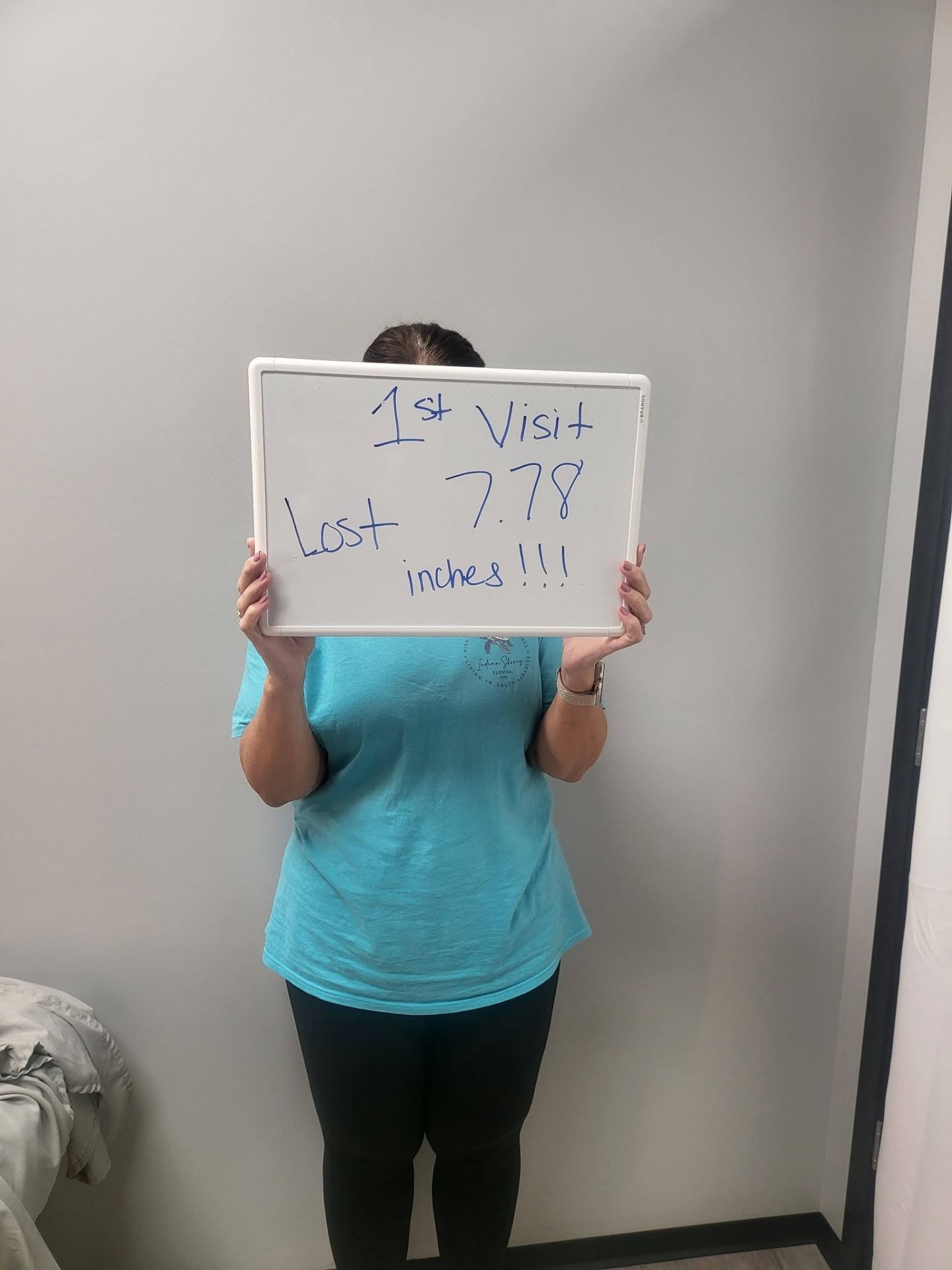 Contour Light client holding a whiteboard: 7.78 inches — Lost on her first visit